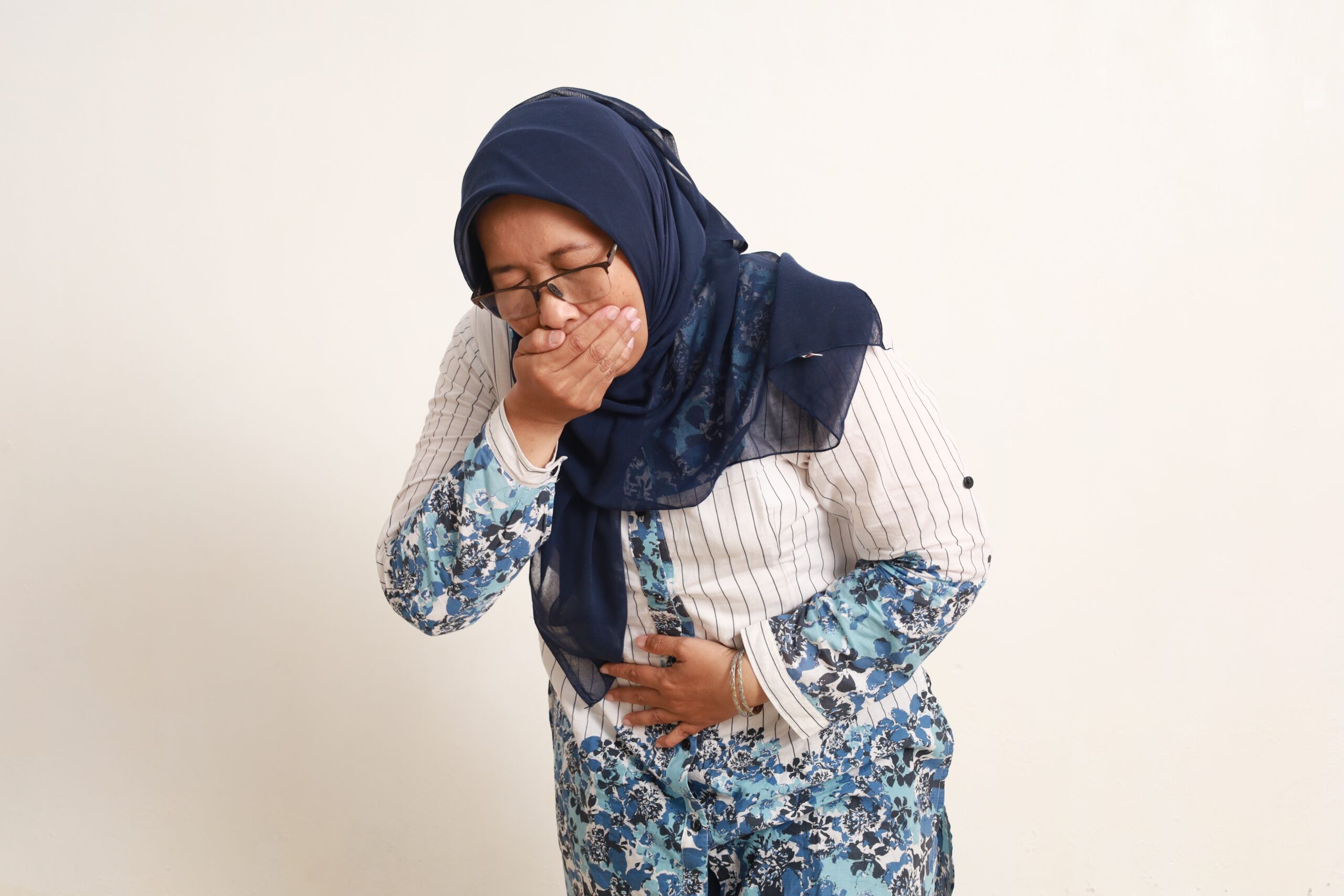 Asian,Elderly,Woman,Suffering,From,Nausea,,Sick,Vomiting